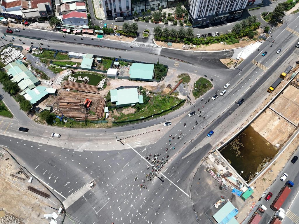 Aerial perspective capturing a bustling intersection in a city with ongoing construction.