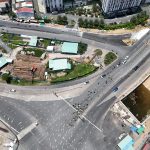 Aerial perspective capturing a bustling intersection in a city with ongoing construction.