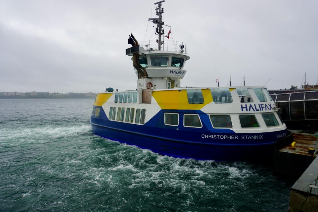 The Christopher Stannix ferry navigating the waters at Halifax harbor on a cloudy day.