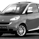 Stylish Smart Fortwo car parked outdoors, showcasing modern design and compact style.